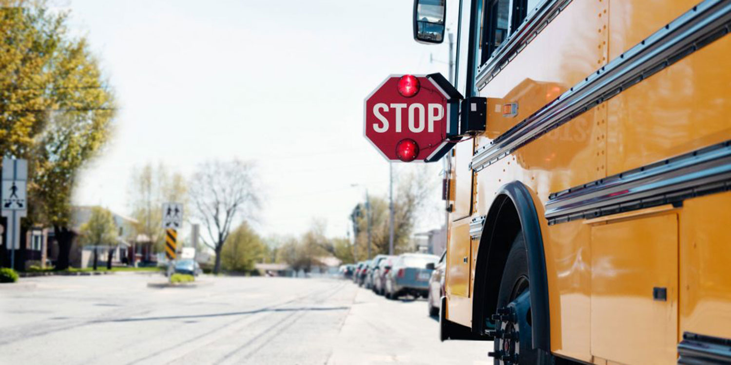 School bus stopped in neighborhood.